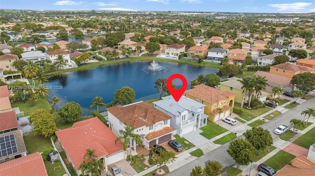 birds eye view of property featuring a residential view and a water view