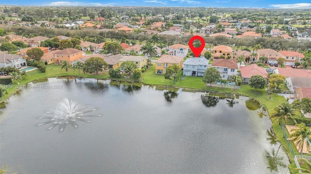 bird's eye view with a water view and a residential view