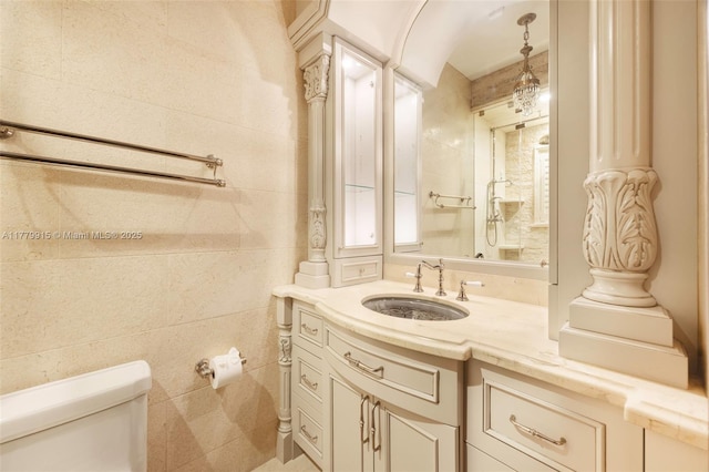 bathroom featuring toilet and vanity
