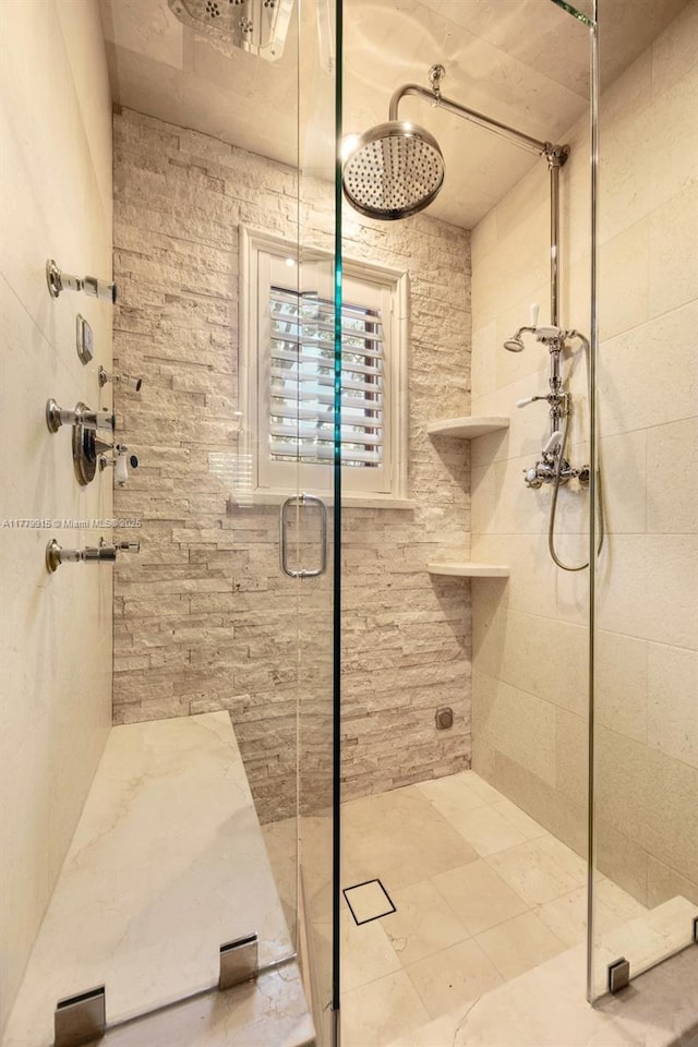 bathroom featuring a shower stall