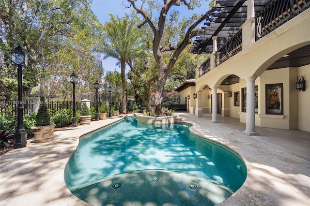 view of swimming pool with a patio, a fenced in pool, and fence