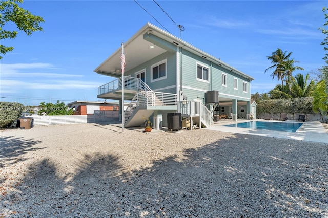 16 N Channel Dr, Key Largo, FL 33037 - rear view of house featuring stairs, fence, central AC, and a patio area