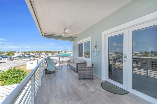 16 N Channel Dr, Key Largo, FL 33037 - balcony with french doors, a ceiling fan, and a water view