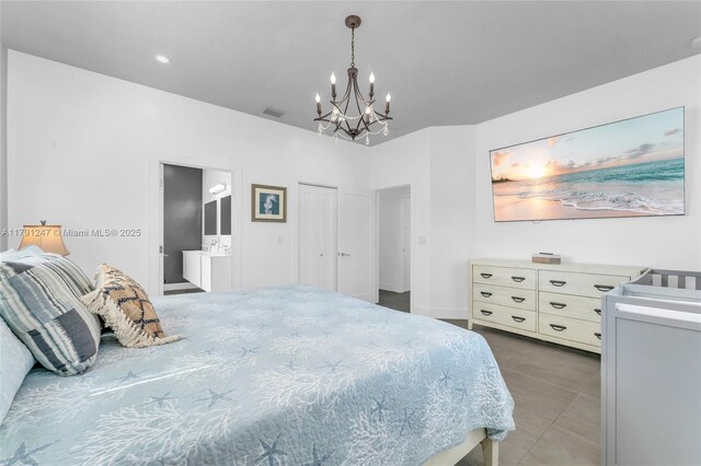 16 N Channel Dr, Key Largo, FL 33037 - bedroom featuring a chandelier and ensuite bathroom