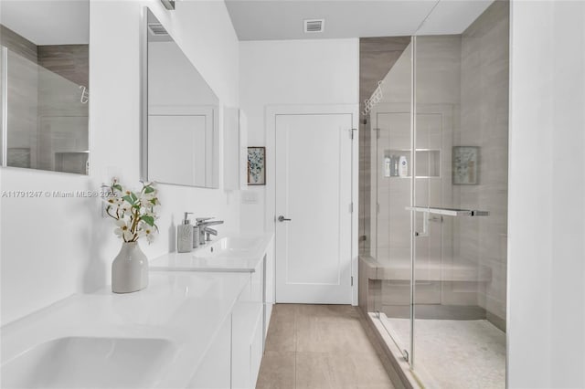 16 N Channel Dr, Key Largo, FL 33037 - bathroom with a stall shower, double vanity, and tile patterned floors