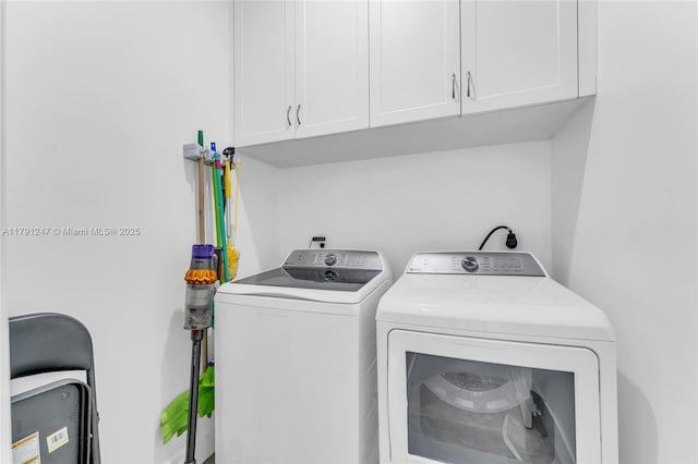 16 N Channel Dr, Key Largo, FL 33037 - washroom featuring cabinet space and washing machine and clothes dryer