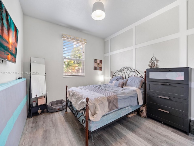 bedroom featuring light wood-style floors