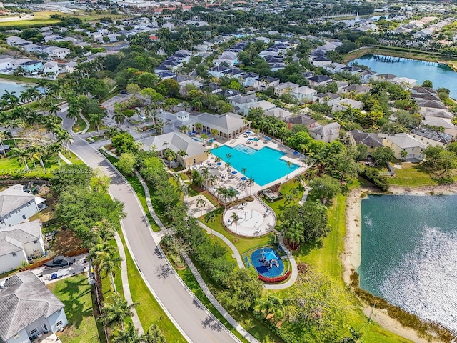 birds eye view of property with a water view and a residential view