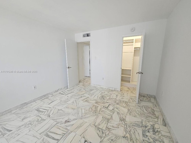 18051 Biscayne Blvd Unit 1704, Aventura, FL 33160 - unfurnished bedroom featuring a closet, visible vents, marble finish floor, and a spacious closet