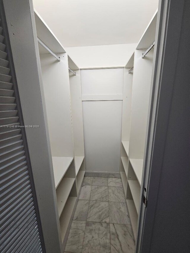 18051 Biscayne Blvd Unit 1704, Aventura, FL 33160 - walk in closet with marble finish floor