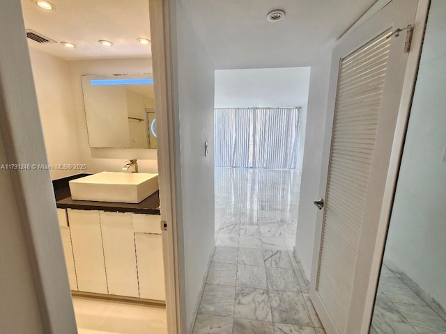 18051 Biscayne Blvd Unit 1704, Aventura, FL 33160 - bathroom with visible vents, vanity, recessed lighting, and marble finish floor