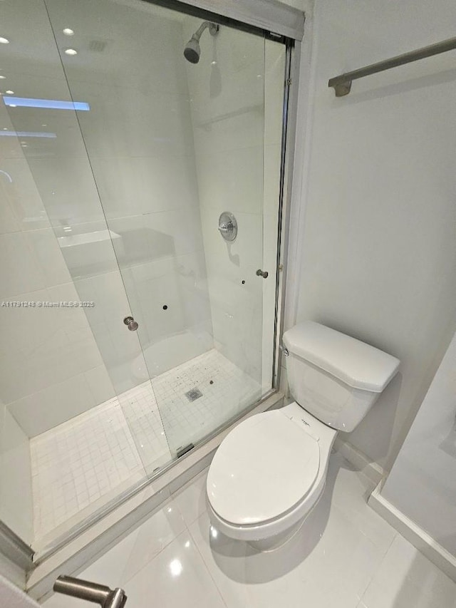 18051 Biscayne Blvd Unit 1704, Aventura, FL 33160 - full bath featuring tile patterned floors, a shower stall, and toilet