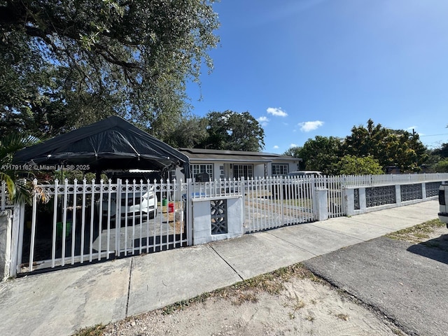 1855 NW 93rd St, Miami, FL 33147 - view of front of home with a gate and a fenced front yard