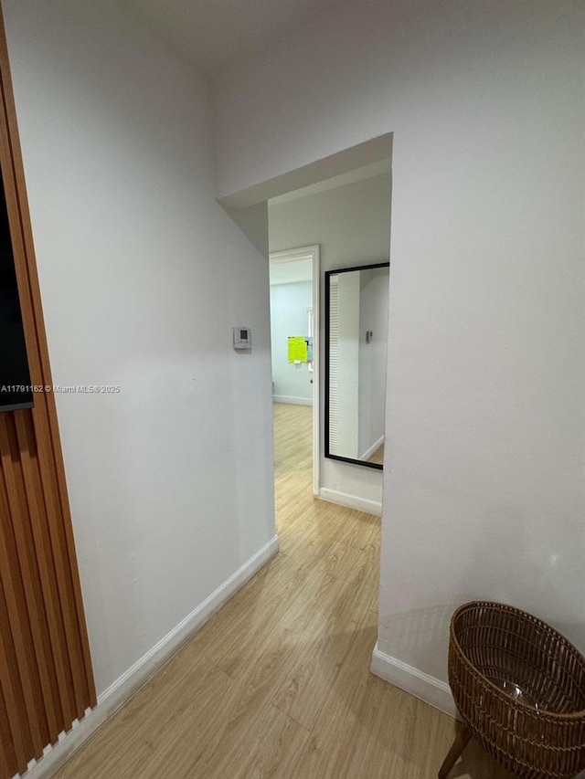 1855 NW 93rd St, Miami, FL 33147 - corridor with light wood finished floors and baseboards