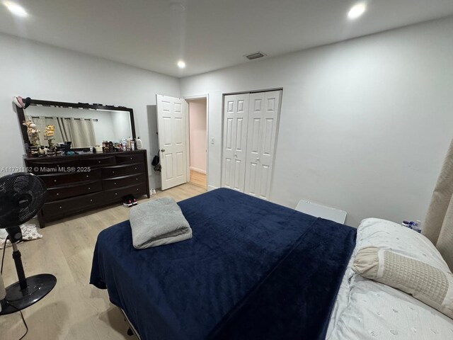 1855 NW 93rd St, Miami, FL 33147 - bedroom featuring visible vents, wood finished floors, a closet, and recessed lighting