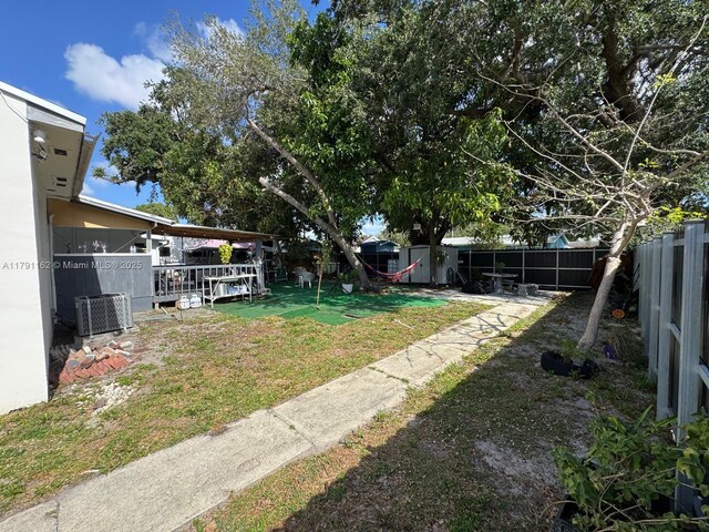 1855 NW 93rd St, Miami, FL 33147 - view of yard with cooling unit and a fenced backyard