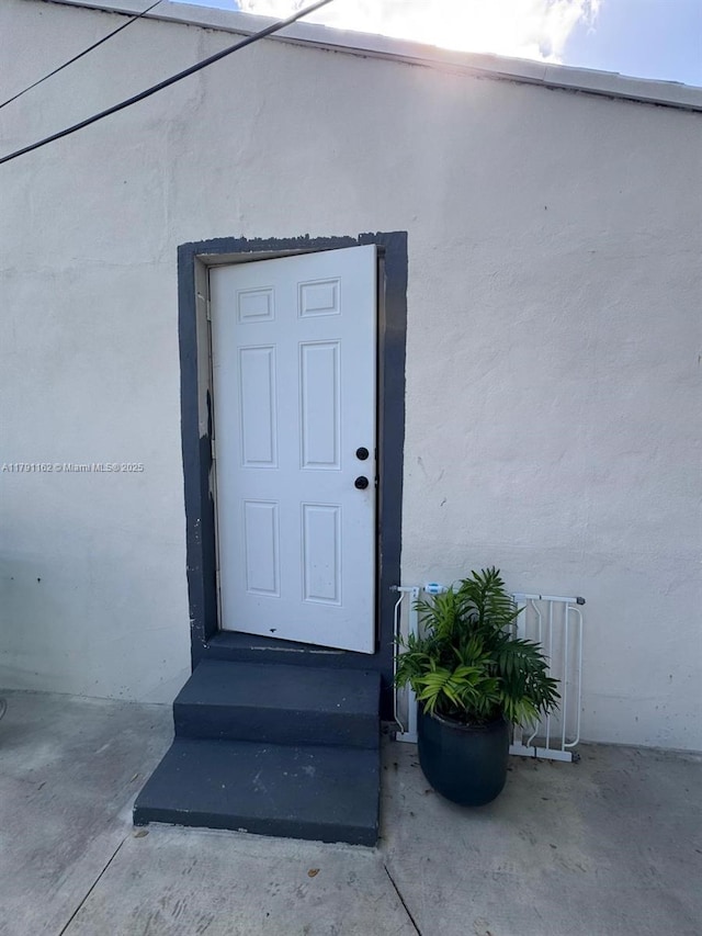 1855 NW 93rd St, Miami, FL 33147 - view of exterior entry featuring stucco siding