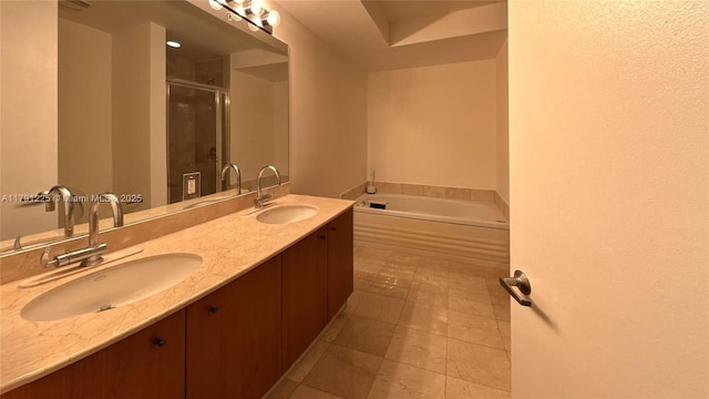 bathroom with a garden tub, double vanity, a sink, and a shower stall