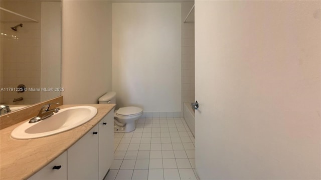 bathroom featuring tile patterned floors, toilet, vanity, and shower / tub combination