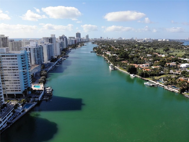 birds eye view of property with a view of city and a water view