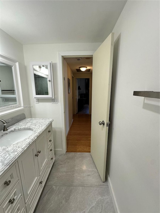300 Bayview Dr Unit 315, Sunny Isles Beach, FL 33160 - bathroom featuring vanity and baseboards