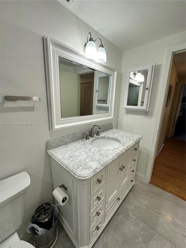 300 Bayview Dr Unit 315, Sunny Isles Beach, FL 33160 - bathroom featuring toilet and vanity