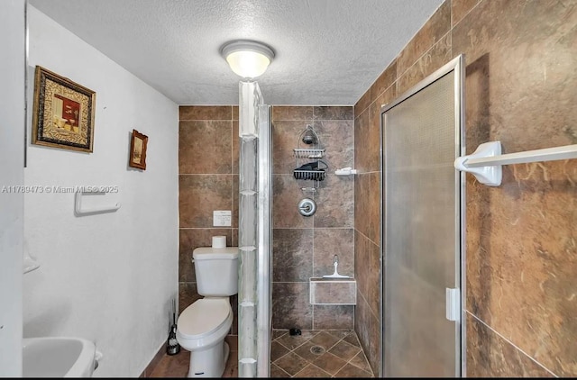 65890 Overseas Hwy, Long Key, FL 33001 - full bathroom with a textured ceiling, toilet, and a stall shower