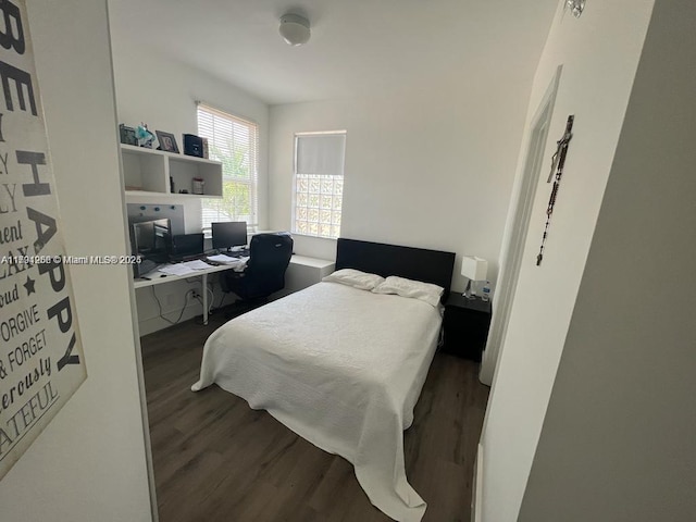 bedroom featuring wood finished floors