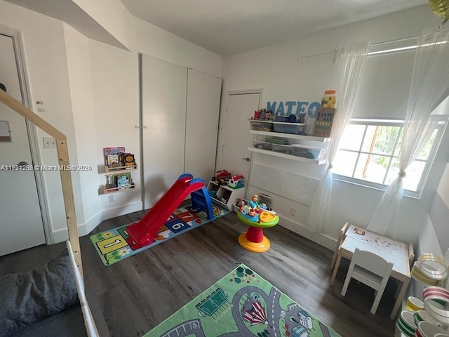 game room with wood finished floors and baseboards