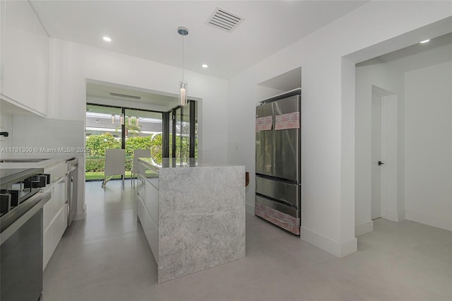 kitchen featuring range, a sink, white cabinetry, visible vents, and modern cabinets