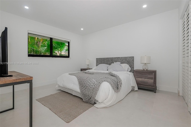 bedroom with recessed lighting and baseboards