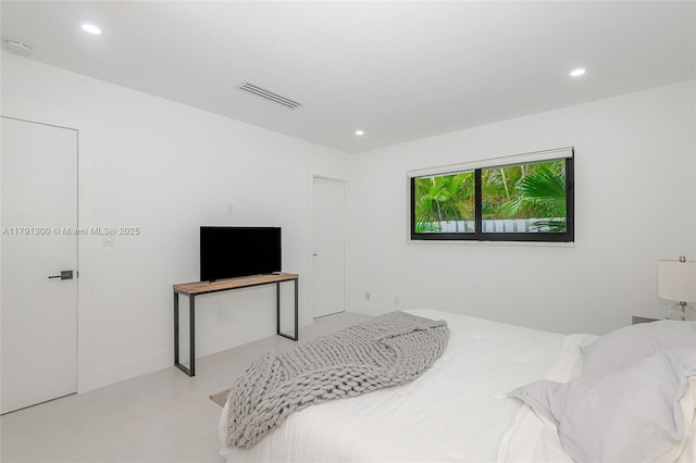 bedroom featuring visible vents, concrete floors, and recessed lighting