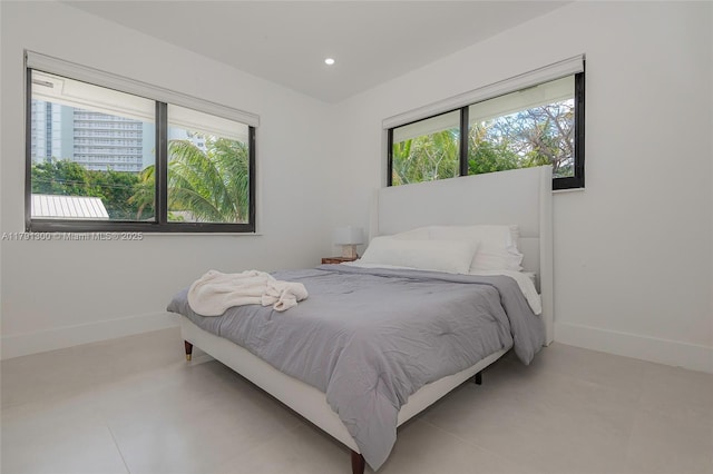 bedroom featuring recessed lighting and baseboards