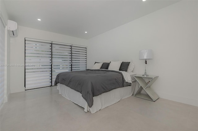 bedroom featuring recessed lighting and a wall mounted AC