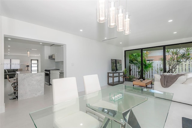 dining area with an inviting chandelier and recessed lighting