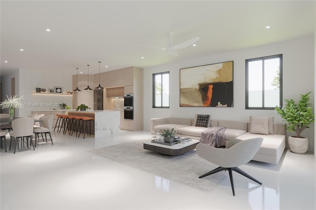 living area with recessed lighting and a ceiling fan