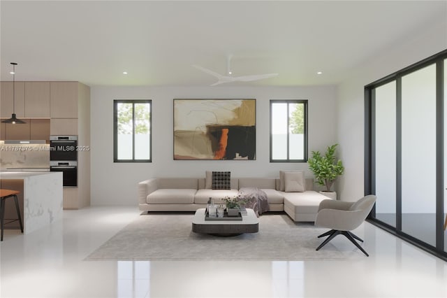 living room with a ceiling fan, recessed lighting, and tile patterned flooring