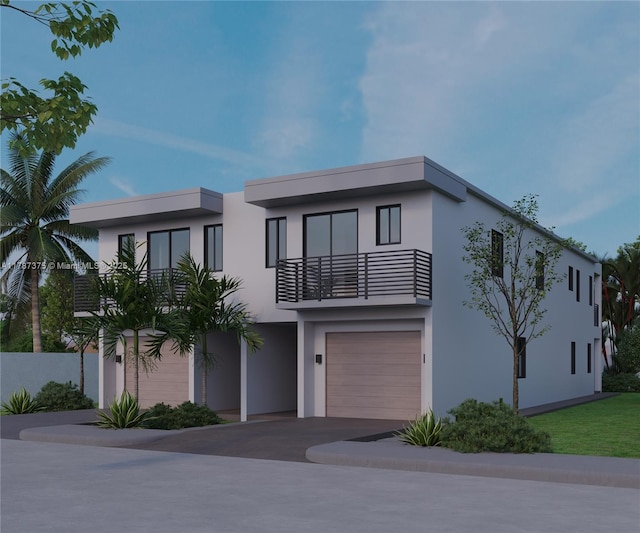 view of front of property with driveway, a garage, stucco siding, and a balcony