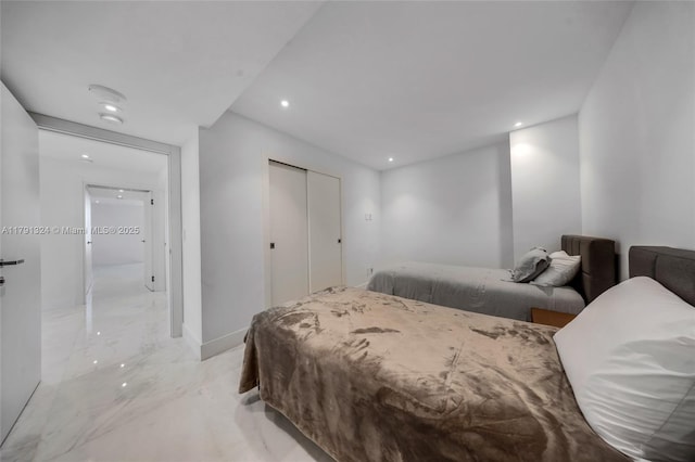 9801 Collins Ave Unit 17R, Bal Harbour, FL 33154 - bedroom with recessed lighting, baseboards, marble finish floor, and a closet