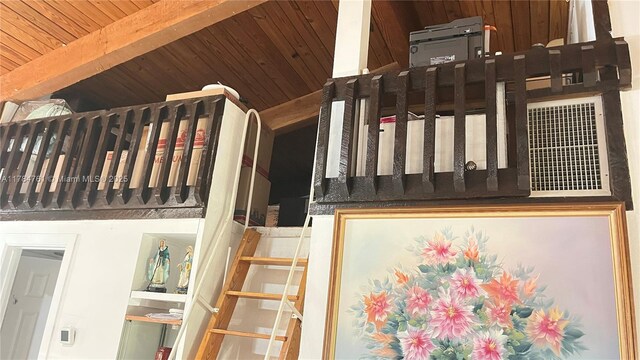 staircase with wood ceiling and beam ceiling