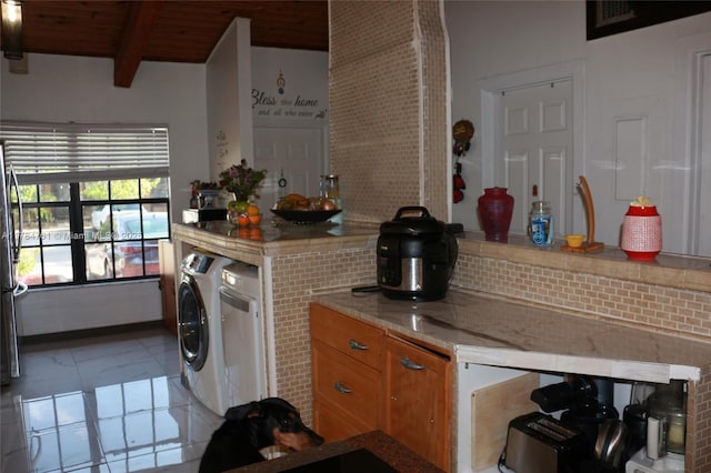 washroom featuring washer / dryer and light tile patterned floors