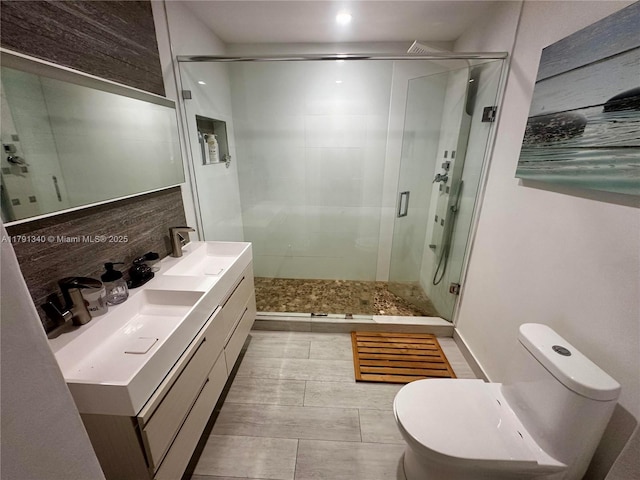 full bathroom featuring toilet, a shower stall, vanity, and tasteful backsplash