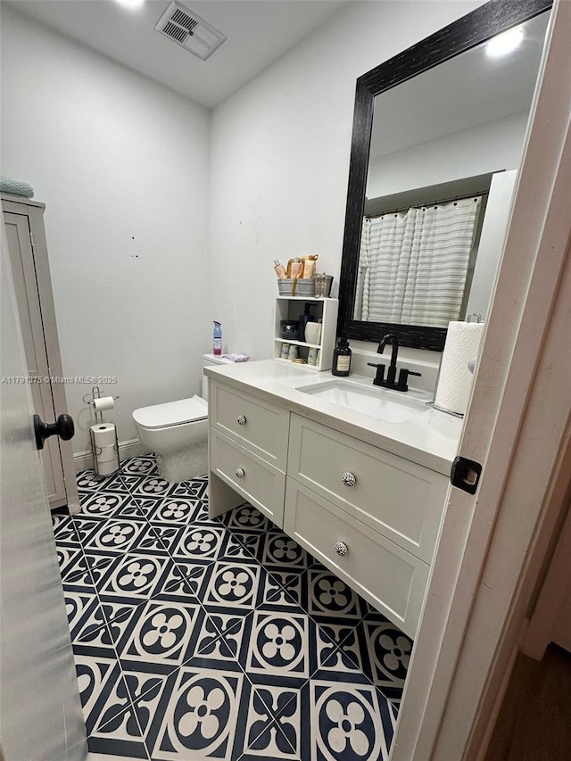13686 SW 116th Ln, Miami, FL 33186 - full bath with tile patterned floors, visible vents, toilet, and vanity