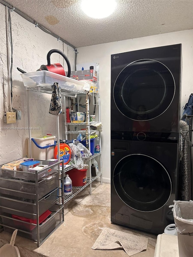 13686 SW 116th Ln, Miami, FL 33186 - laundry area featuring stacked washer and dryer, a textured ceiling, and laundry area