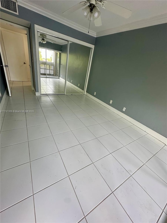 3301 Spanish Moss Ter Unit 302, Lauderhill, FL 33319 - unfurnished room with a ceiling fan, ornamental molding, light tile patterned floors, and baseboards