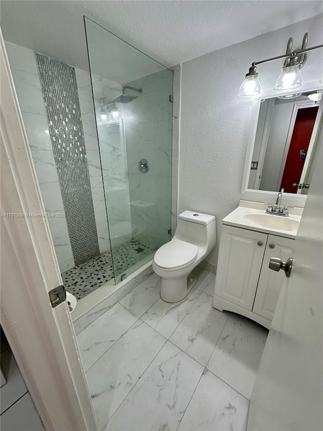 3301 Spanish Moss Ter Unit 302, Lauderhill, FL 33319 - full bathroom featuring a textured wall, marble finish floors, toilet, a walk in shower, and vanity