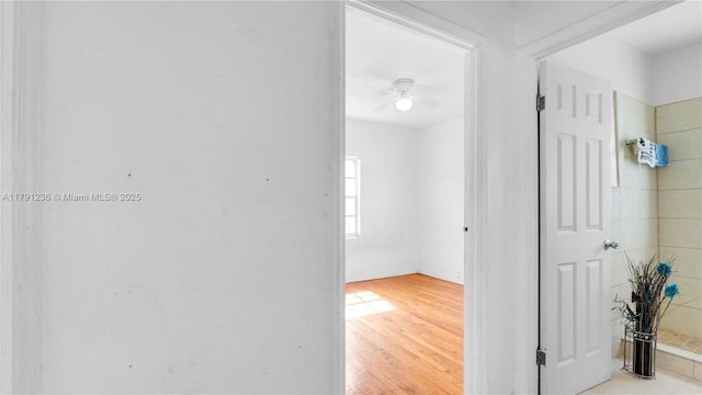 hallway with light wood-type flooring