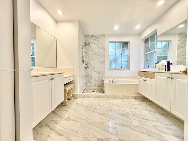 bathroom with a tile shower, a garden tub, and marble finish floor
