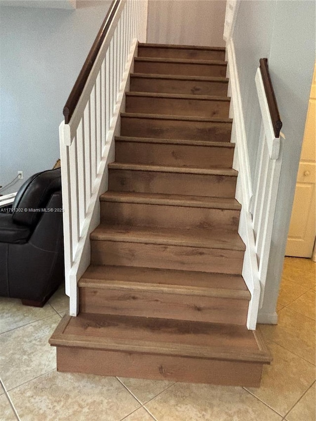 stairs with tile patterned flooring
