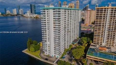 301 174th St Unit 1105, Sunny Isles Beach, FL 33160 - drone / aerial view of a skyline view and a nearby body of water